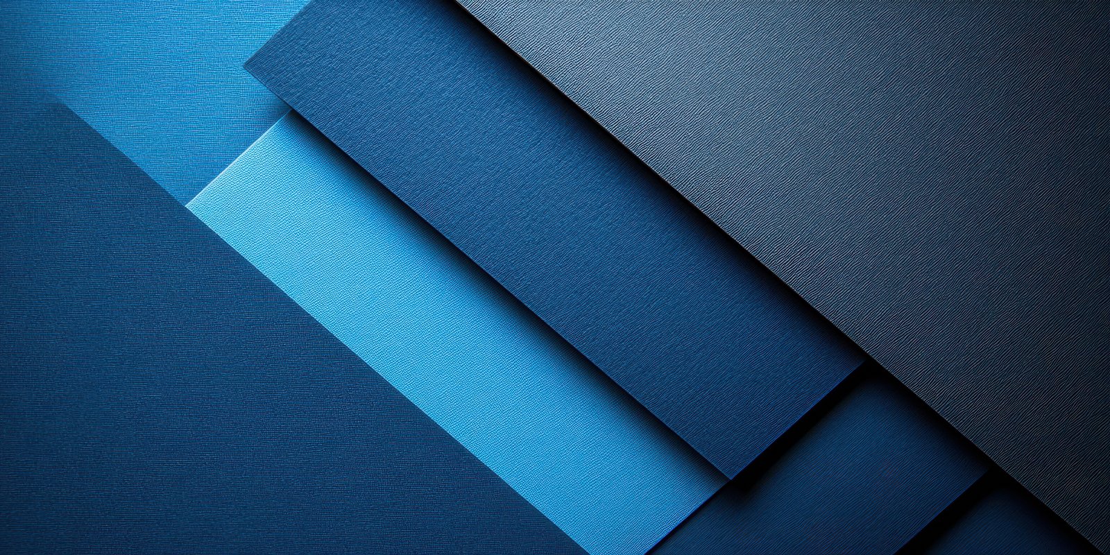 Layers of blue paper arranged in a visually appealing composition showcasing texture and color variations